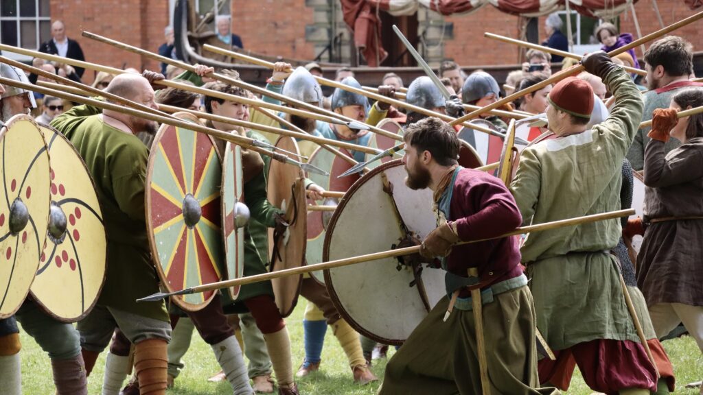 a bunch of soldiers dressed as vikings in a battle